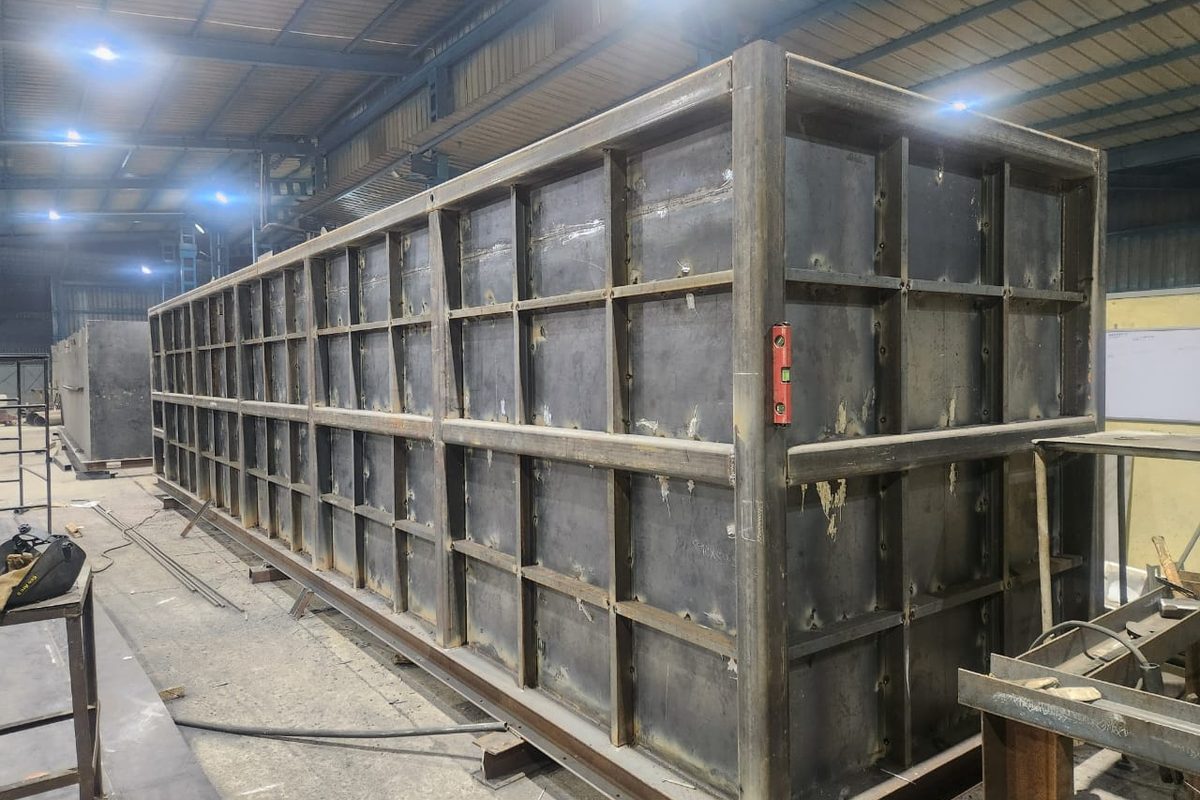 Sectional storage tank fabricated for a campus water system